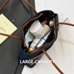 Interior view of denim tote bag showing spacious capacity for cosmetics and skin care