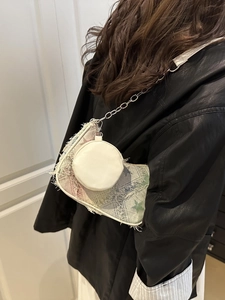Chic knit patchwork canvas tote bag with fringe details and a small round pouch