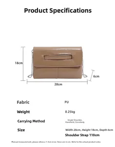 Close-up of brown PU leather handbag with silver chain and cutout handle detail