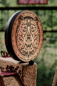 Detail of handmade Siberian Shaman drum featuring a majestic copper bear head pattern