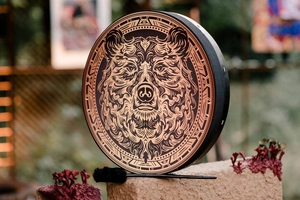 Detail of Siberian Shaman drum featuring a grizzly bear motif on a wooden frame