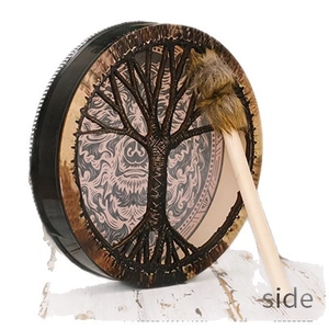 Siberian shaman drum with tree of life pattern and wooden mallet on white wood background