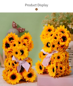 Detailed view of two sunflower bear figurines with silk bows for home garden decor
