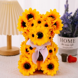 Detailed close-up of a decorative bear figurine made of vibrant artificial sunflowers