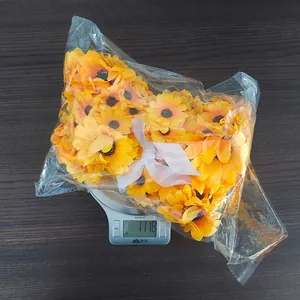 Weight measurement of 111.8g for a bunch of artificial yellow sunflowers in clear packaging