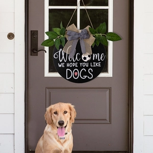Rustic round Welcome door sign featuring We Hope You Like Dogs text and a Golden Retriever