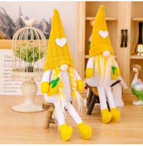 Charming pair of yellow knit summer gnomes with lemon accents and long dangling legs