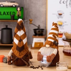 Pair of coffee-themed Christmas gnomes with knit hats and coffee cup for home decor