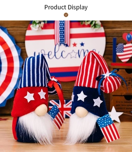 Detail of two patriotic gnomes with star-spangled hats and flags for 4th of July decor