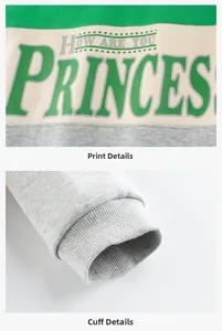 Detail of color-block kid sweatshirt with printed lettering and ribbed cuffs texture