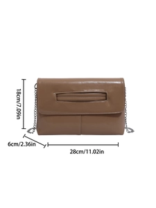 Brown envelope clutch bag with chain strap and cutout handle detail, size 28x18x6cm