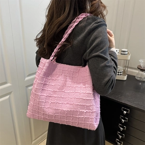 Pink textured bubble fabric tote bag with braided straps for women casual commuter style