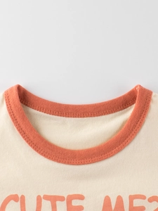 Light beige cotton kids T-shirt with orange contrast collar and Cute Me print detail