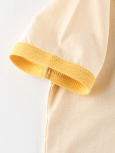 Kids cream cotton short sleeve t-shirt with yellow ribbed cuffs and knit texture