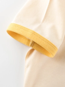 Short sleeve cotton T-shirt for kids with cream fabric and yellow ribbed cuff detail