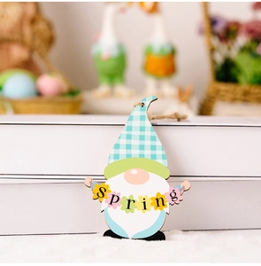 Detail of wooden Easter gnome ornament with SPRING banner against a soft home backdrop