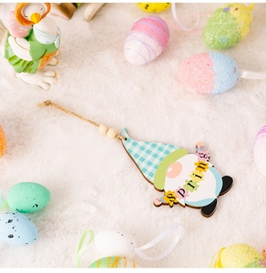 Detail of wooden Easter gnome pendant with SPRING text and blue checkered hat