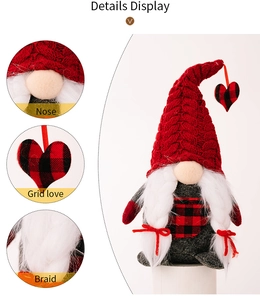 Detail view of gnome plush showing craft nose, plaid heart charm and braided hair features