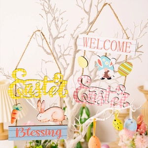 Detailed view of colorful wooden Easter ornaments with rabbit and carrot patterns on branches