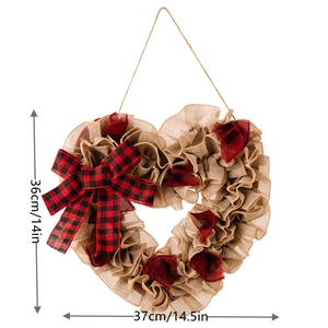 Macro shot of heart-shaped burlap wreath with red buffalo plaid bow and size markers