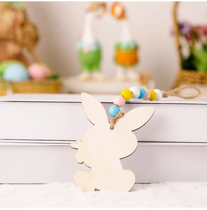 Detail of wooden Easter rabbit pendant with colorful beads and hemp rope hanging loop
