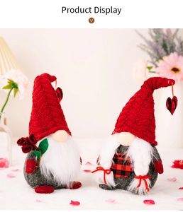 Detail of couple gnomes with red knit hats, white beards, and plaid hearts for Valentine's