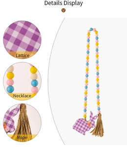 Detail view of Easter wooden bead garland with purple plaid bunny tag and hemp rope tassel