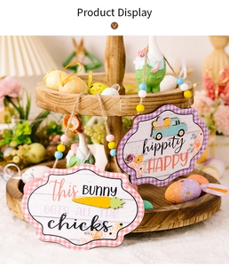 Detail of Easter wooden sign with bunny carrot prints and colorful wood beads