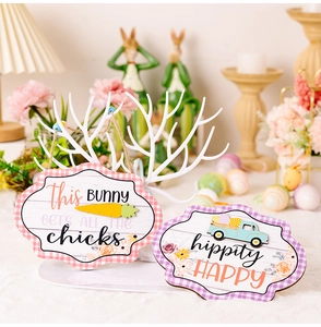 Detail of Easter wooden plaques with plaid borders and festive bunny graphics for home decor