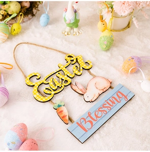 Detail of wooden Easter hanging sign featuring rabbit, carrots and Blessing lettering