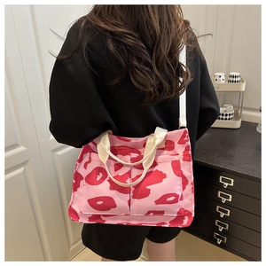 Detailed back view of pink leopard print canvas tote bag with front pockets and wide strap