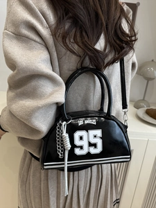 Black crescent underarm bag with Los Angeles 95 print and silver chain detail