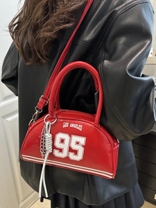 Retro red crescent shoulder bag with Los Angeles 95 print and metallic chain detail