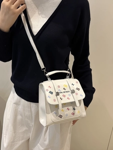 Sac à dos blanc style vintage avec imprimés étoiles, lettres et motifs graffiti