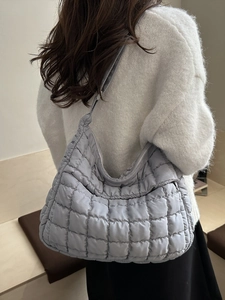 Padded light gray quilted shoulder bag with 2025 minimalist pleated puffer design