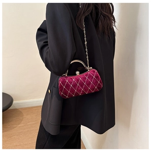 Velvet evening bag in wine red with diamond lattice pattern and gold chain strap
