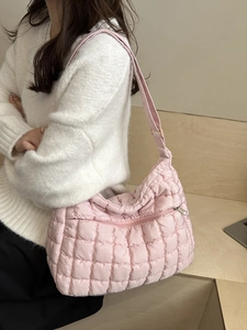 Pink quilted puffer shoulder bag for women with adjustable strap and front zipper pocket