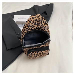 Detail view of leopard print fitness waist bag with multiple functional zip compartments