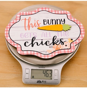 Easter wooden sign decoration on a digital scale showing weight of 46.3g