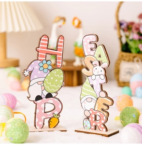 Detailed view of wooden Easter gnome letter ornaments and rabbit tabletop decorations
