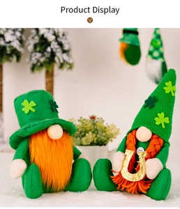 Pair of festive St. Patrick's Day green plush gnomes with orange beards and clover hats