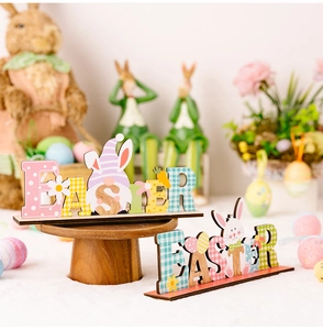 Detailed view of two festive wooden Easter desktop signs with cute bunnies and gnomes