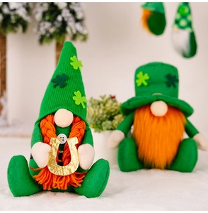 Detail of St. Patrick's Day plush gnomes with green hats and orange beards on soft surface