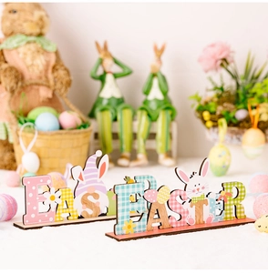 Detailed view of colorful wooden Easter letter signs with gnomes and rabbits on a table