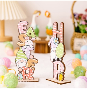 Easter wooden desk signs with bunnies and gnomes on a soft white fluffy surface