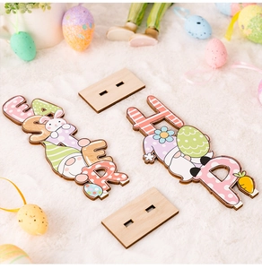 Close-up of wooden Easter desktop signs with colorful gnomes, bunnies and eggs