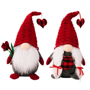 Pair of Valentine's Day red knitted gnomes with white beards, braids and heart charms