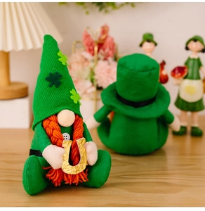 Macro view of St. Patrick's Day gnome featuring green clover hat and golden lucky horseshoe