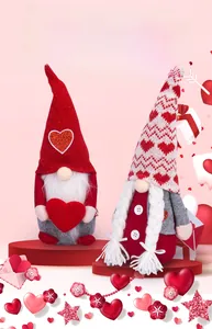 Detailed view of Valentine's Day gnomes with sequined hearts and knitted hats decor