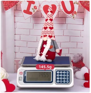 Detailed close-up showing the Valentine plush gnome weight of 145.5g on a digital scale